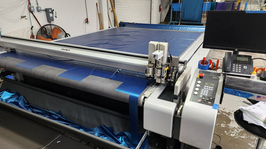 Factory photo of a ZUND cutting table setup to cut patterns for waterbed